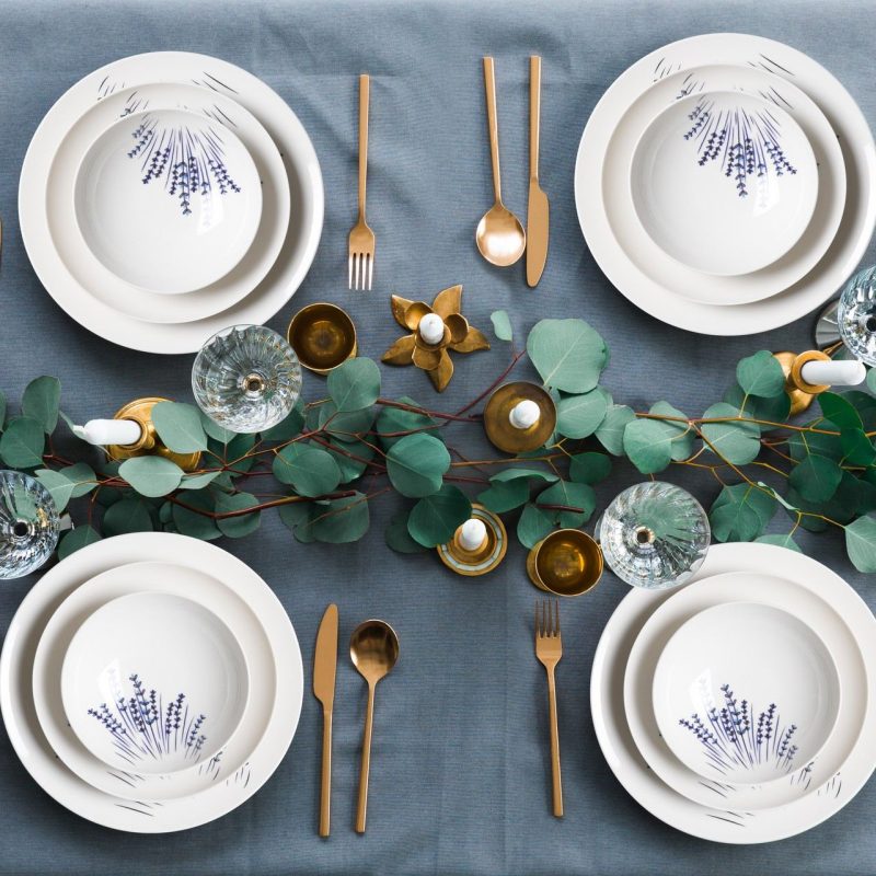 Top,View,Of,Rustic,Table,Setting,With,Eucalyptus,,Tarnished,Cutlery,